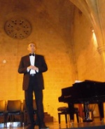 Fikri Toros, chairman of the Kyrenia Chamber Choir, opening the evening